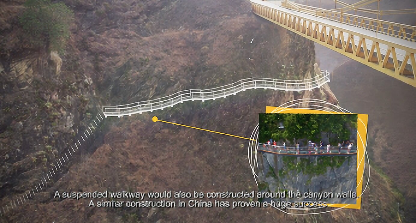 A suspended walkway with a mountainous backdrop